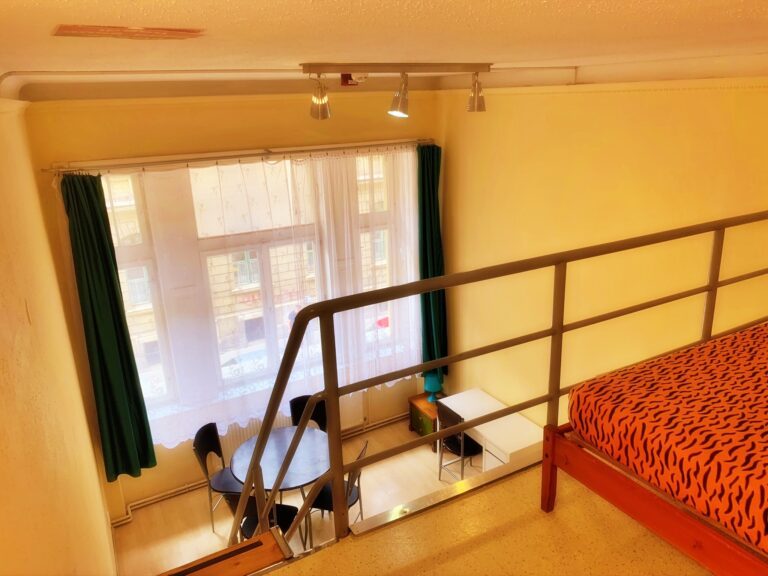 Modern bedroom area with sleek furnishings.