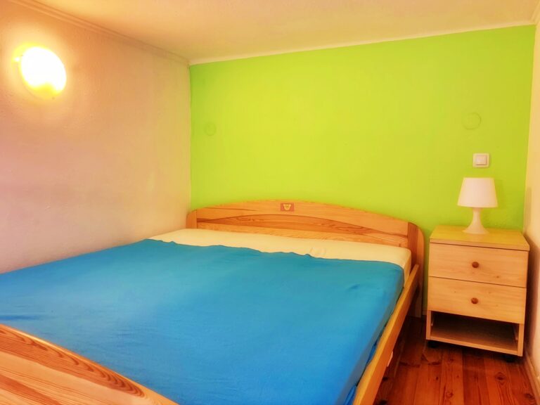 Spacious bedroom with elegant furnishings.