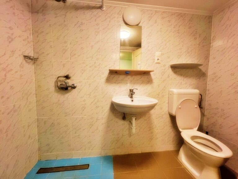 Spacious bathroom with contemporary design elements.